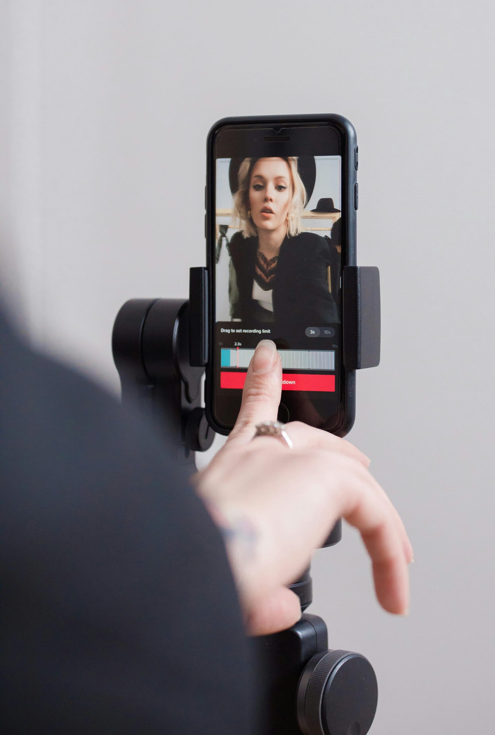 person filming themselves on a phone